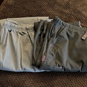 Dark grey with lime green accent and black with pink accent Wink scrub pants